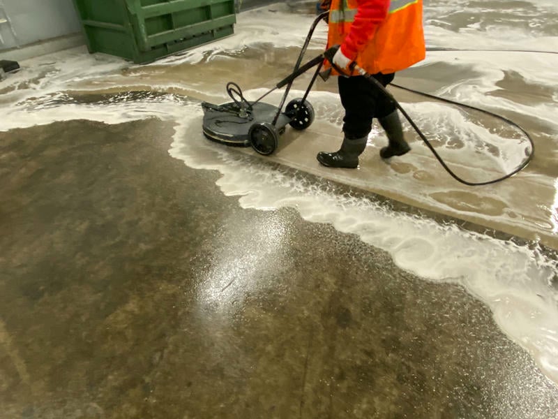 Power washing a commercial facility exterior before winter